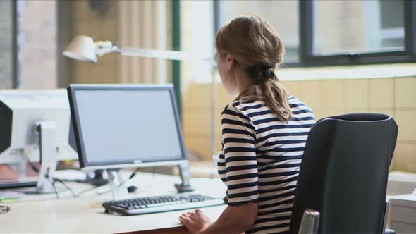 Businesswoman using computer in office