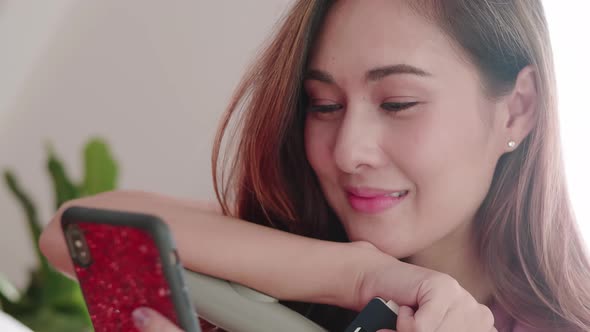 Woman happy selfie portrait with her passport and credit card before travel trip alt