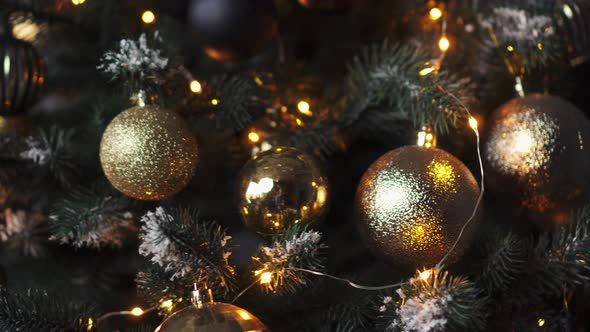 Christmas Tree Decorated with Decorative Balls and Lights on a Dark Background alt