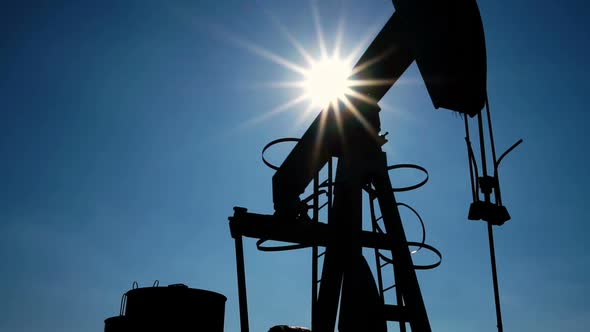 pumpjack at an oil drilling site, motorized slider shot alt