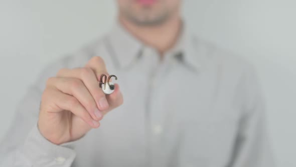 Debate Man Writing on Transparent Screen alt