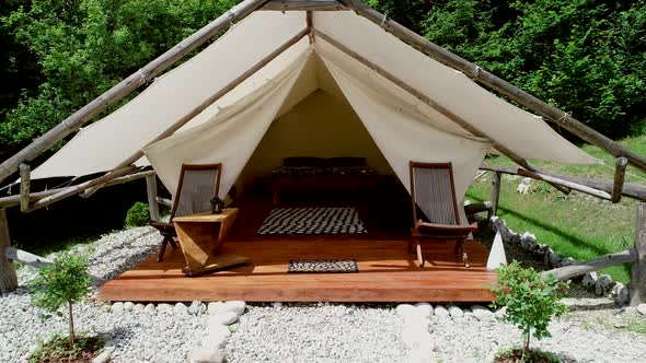 Tracking shot of a glamping tent in an eco camping in Slovenia. alt