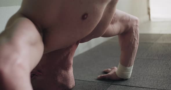 Training Vertical Push-ups, Intense Strength Exercise in Closed Gym. Men Doing Vertical Push-ups