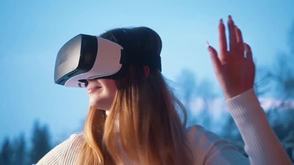 Excited Young Caucasian Woman Enjoying Virtual Reality alt