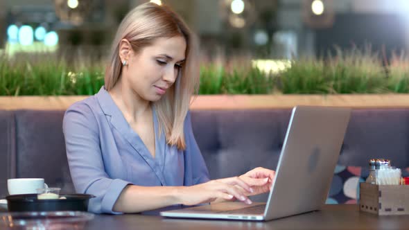 Medium Shot Stylish Independent Freelancer Woman Typing Text on Keyboard Using Laptop PC alt