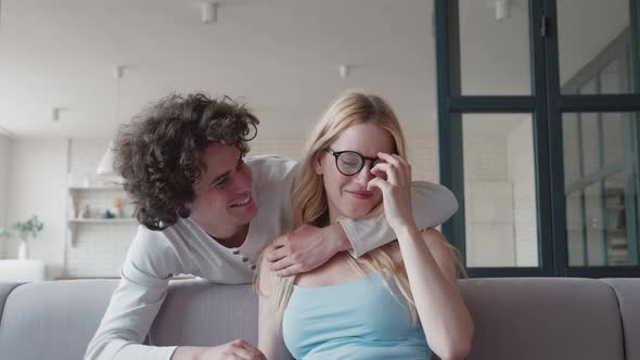 Attractive Happy Smiling Blond Girlfriend Working on Laptop and Talking with Her Loving Joyful Curly alt
