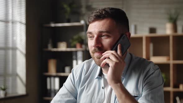 Smiling Sincere Young Man Communicating Distantly By Cell Phone Call Talking Speaking with Colleague alt
