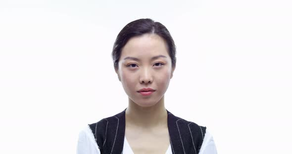 Beautiful Happy Young Adult Asian Professional Business Woman Smiling and Serious