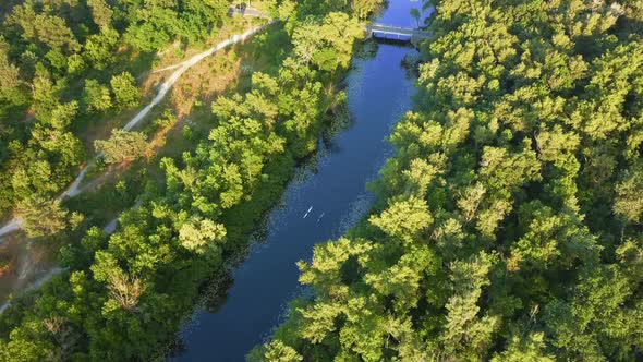 Flying Over the River on a Sunny Bright Day People Resting on Kayaks and Sapa Sun Glare in the