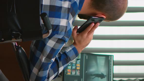 Disabled Freelancer Videographer Talking on Phone alt