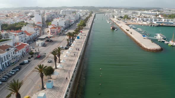 Aerial Drone View of Picturesque City of Lagos Algarve Portugal Drone Flying Forward Above Harbor alt