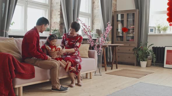 Happy Chinese Family Celebrating Lunar New Year alt