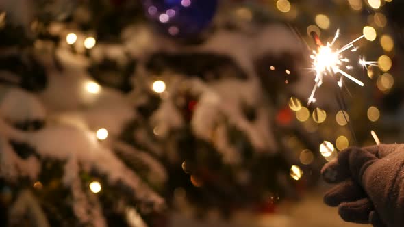 Sparkler Firework Burning Christmas Tree in Snow New Year or Xmas Bengal Light alt