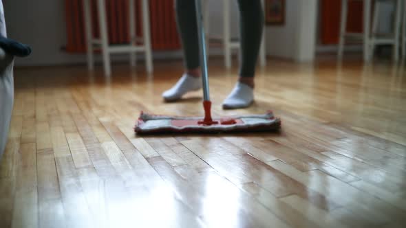 Woman Using Mop Cleaner to Do Household Chores Faster