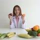 nutritionist holding and present many fresh vegetables and fruit - VideoHive Item for Sale