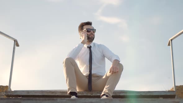 Successful Confident Businessman Talking On Phone. Businessman Talking By Smartphone. Mobile Phone. alt