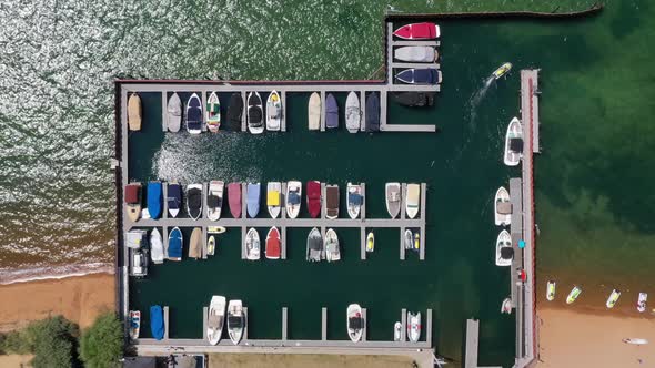 Overhead Shot Of Boats Moored At Marina By Lake Tahoe In USA. - aerial alt