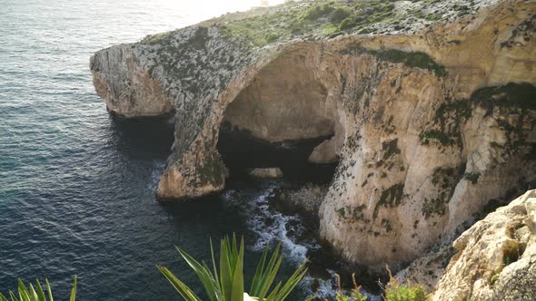 Panoramic View of Blue Grotto Sea Caves Being Washed with Waves of Mediterranean Sea