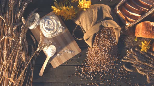 Still life with Bread, Wheat, Flour and Flowers. alt
