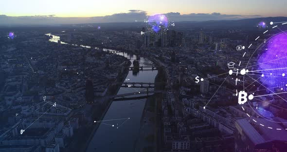 Aerial Panoramic Footage of River Flowing Through Large City at Twilight alt