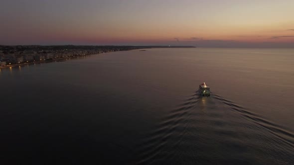 Aerial Flight Above the Sea and Coast Line on the Horizon in Greece alt