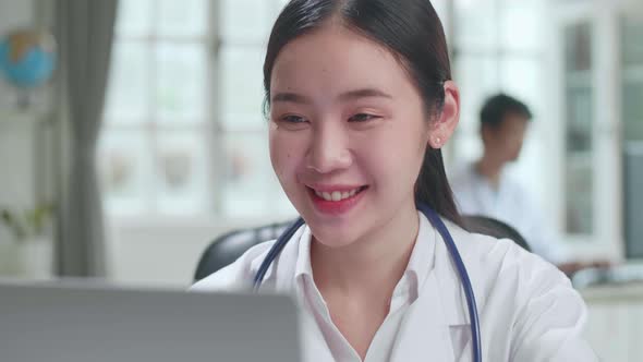 Close Up Young Asian Woman Doctor Is Using Laptop In Workplace. Medical Concept alt