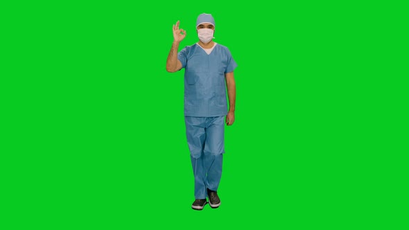 Surgeon In Mask And Uniform Showing Okay Sign While Walking 