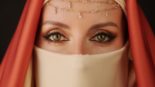 Close Up Portrait Of Beauty Young Muslim Woman In Hijab Looking At Camera.