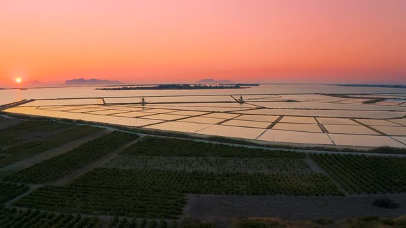 Aerial Drone Footage sunset of Saline di Marsala, Salt pans in Island of Sicily Italy 4K