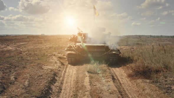 Military Tank Shooting Fire on Battlefield