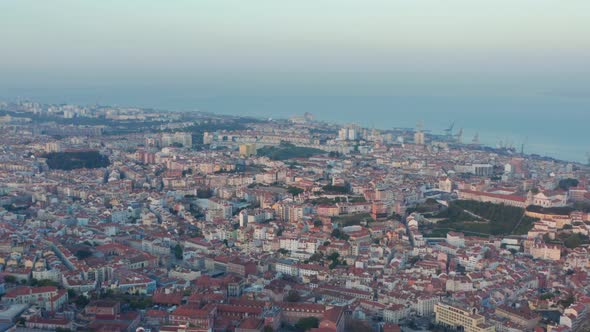 Wide Aerial View of Rooftops of Coastal Residential Colorful Houses in Downtown City Center of alt