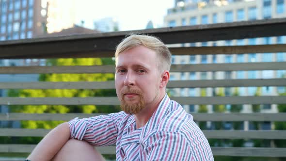 portrait caucasian man in city park