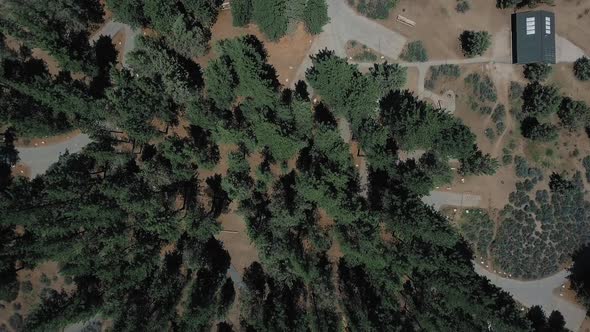 Overhead drone shot of Big Bear Solar observatory near lake in California, USA alt