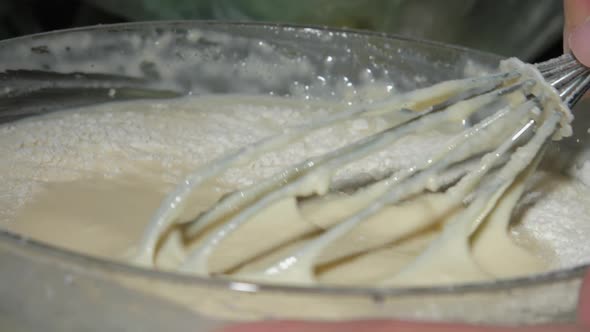 Housewife Mixes White Pancakes Dough with Flour in Bowl alt