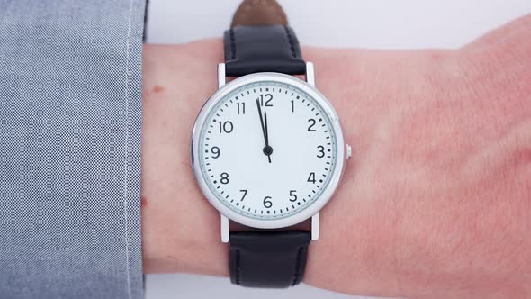 Close up of a man wearing a wrist watch