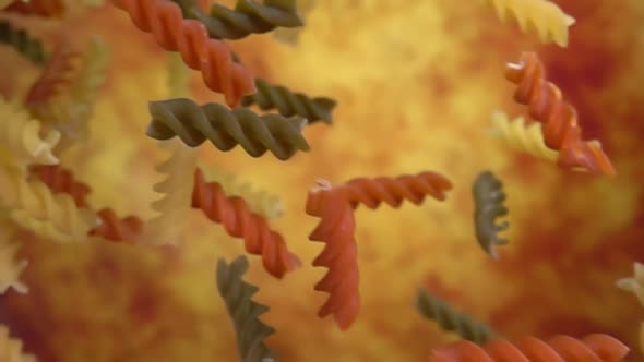 Closeup of the Pasta Fusilli Falling Diagonally on a Yellow Ochre Background alt