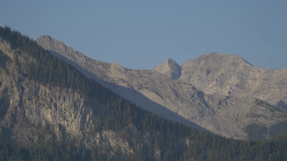 Pan right of rocky mountains peaks alt
