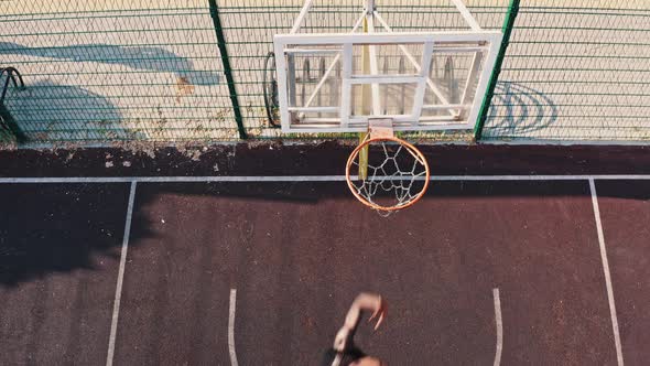 Top View Multiethnic Group of Four Has a Training Session on the Basketball Court alt