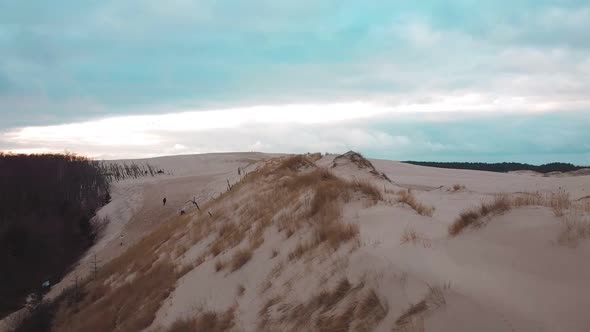 Sand dunes from drone. Amazing sea desert. Beautiful sky.