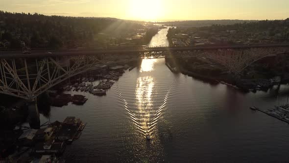 Amazing Lighting Aerial Of Big City Bridge And Boat Cruising In Canal