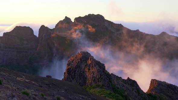 Facing the sunset on two of the rocky mountains with beautiful sun reflections during the golden hou alt