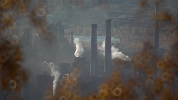 Air pollution from chimneys of an industrial plant alt