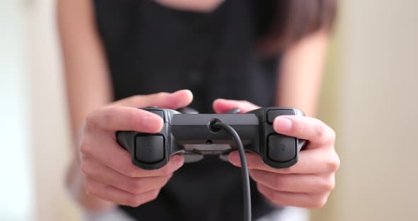 Woman playing video game alt