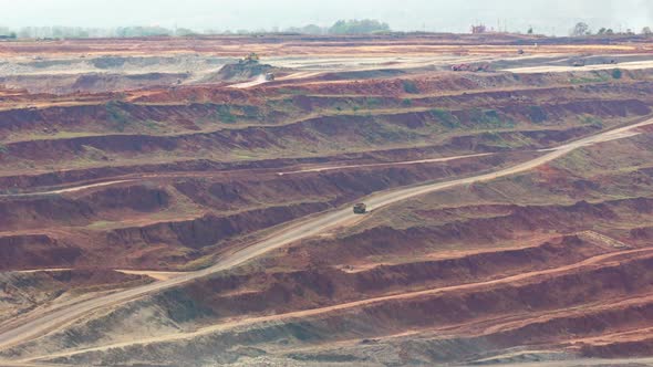 Mining Dump Trucks Working in Lignite Coalmine alt