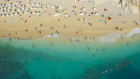 Aerial Top View on Famous Kaputas Beach Blue Sea Umbrellas and Tourists in Kas Turkey alt