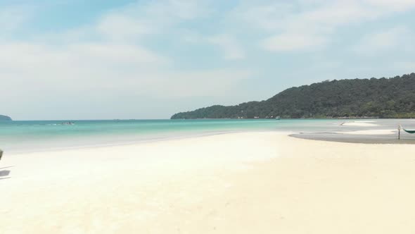 White sand beach and turquoise water, Koh Rong Samloem, Colombia. Aerial forward alt
