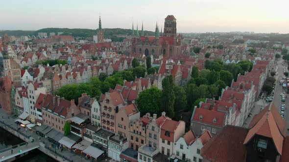 Establishing Aerial View of Gdansk Landmarks with Old Town Roofs and River