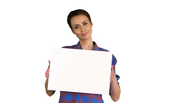 Attractive Woman Shows Blank White Poster on White Background alt