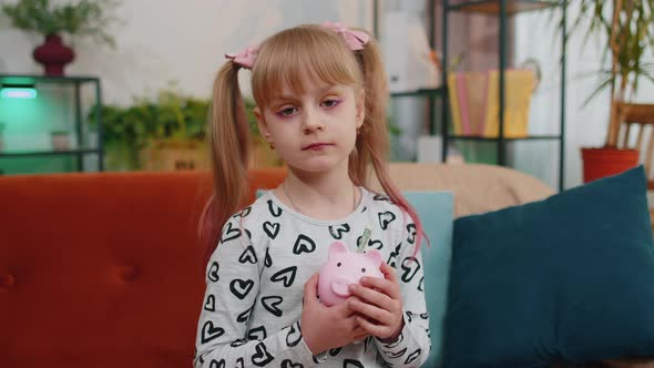 Frustrated Poor Little Kid Girl Hold Almost Empty Piggybank with Only One Dollar Cash Bankruptcy alt