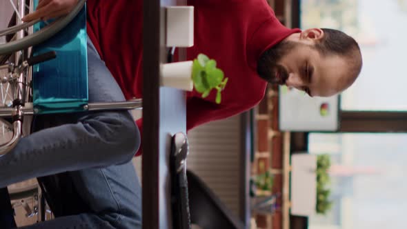 Vertical Video Young Adult with Disability Working on Financial Analysis alt